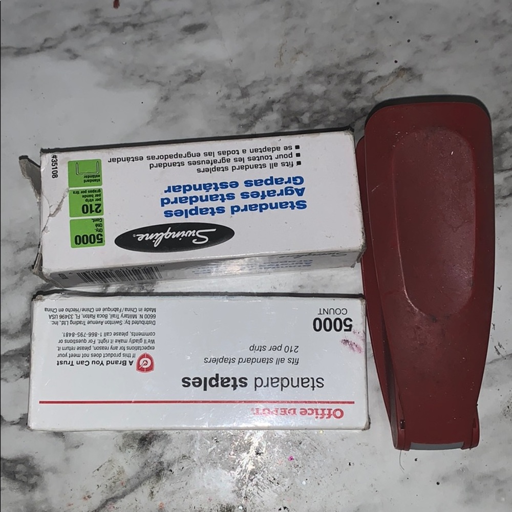 A stapler and two boxes of staples